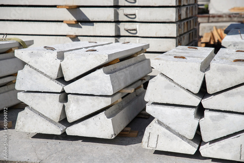 Reinforced concrete steps of stairs in stacks at the warehouse site of the factory.