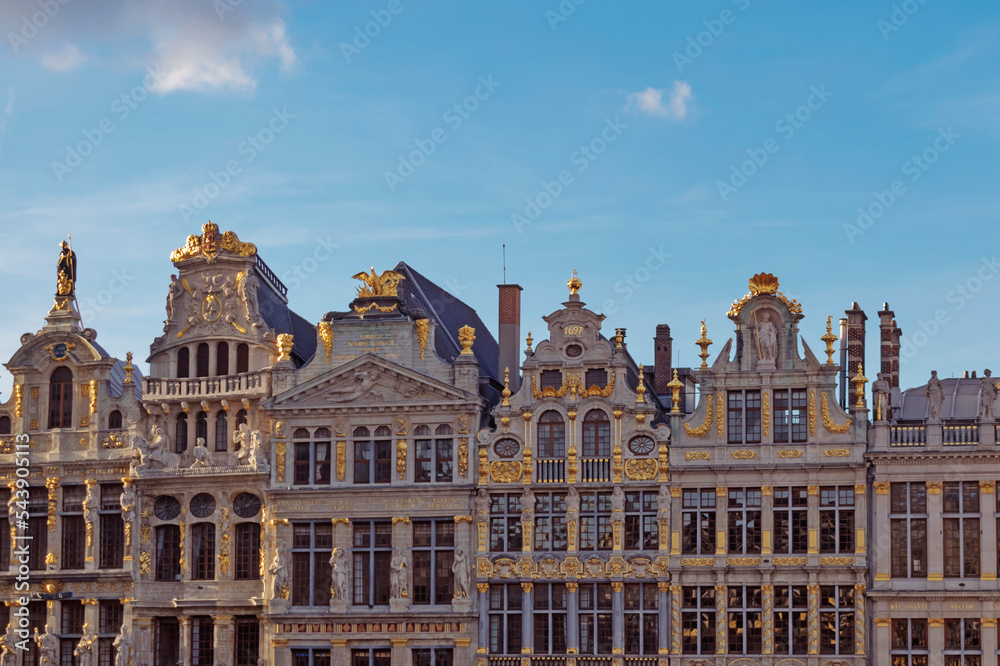 Abstract urban or vintage background featuring details of architecture and roofs of medieval buildings at sunset at Grand Place in Brussels Belgium. 