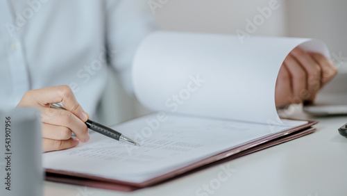 Asian business woman Hand writing ideas And taking notes