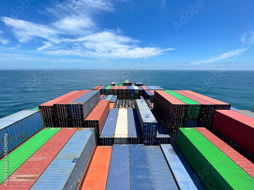 Many containers stowed on deck of Ultra large container ship located in open sea