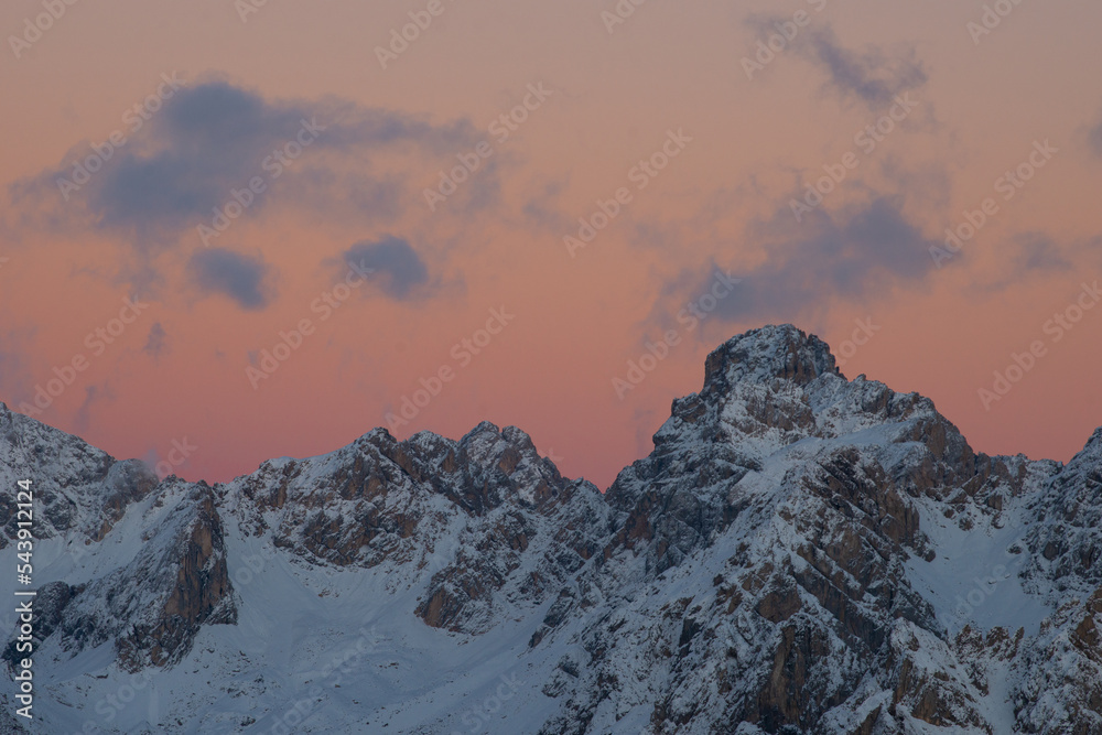 sunset in the dolomites covered by snow