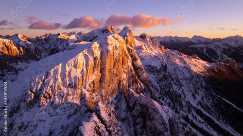 sunset in the mountains covered by snow