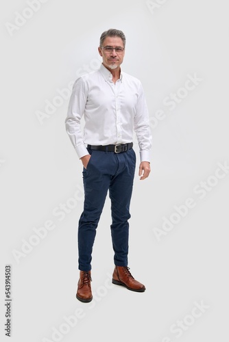 Full length business portrait of confident businessman. Entrepreneur in white shirt, smiling, Happy mid adult, mature age man standing, smiling, isolated on white background.