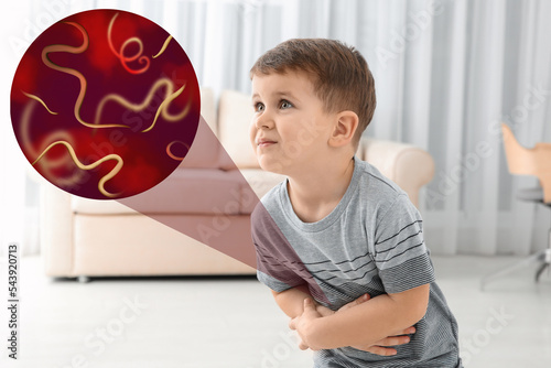 Parasites under microscope and boy suffering from helminthiasis photo