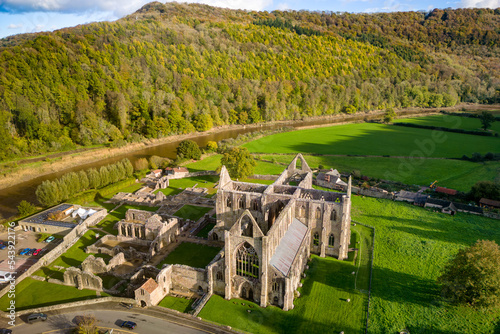 Aerial view of an ancient ruined monastery in Wales (Tintern Abbey. 12th century AD) photo