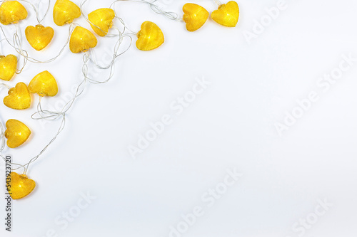 Bright orange lanterns in the shape of hearts. Top view, a holiday card with a white background. Space for text. 