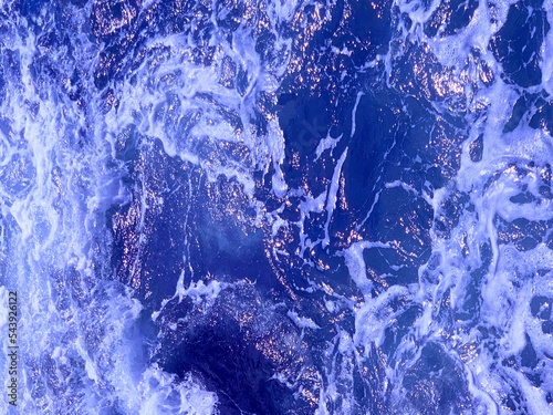 Wallpaper Mural Stormy ocean waves, shiny blue water .