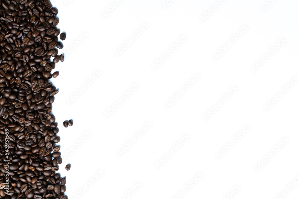 Naklejka premium Coffee beans isolated on white background with space for text. Roasted coffee beans as background. Flat lay, top view, copy space