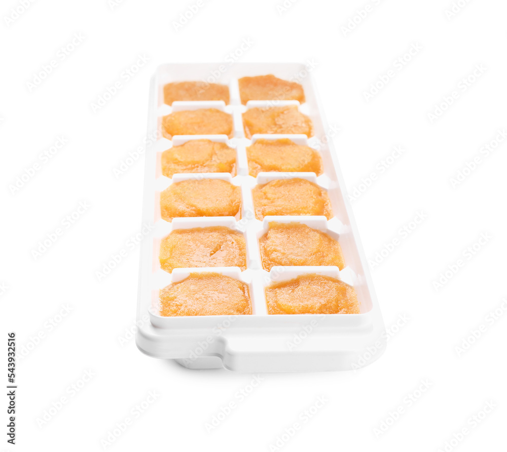Puree in ice cube tray on white background. Ready for freezing Puree in ice cube tray on white background. Ready for freezing