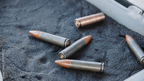 Bullets caliber 366 TKM lie on a soft surface photo