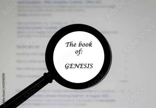  The Book of Genesis from the Holy Bible, illustrated inside a magnifying class, zoomed in. photo