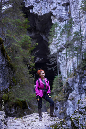 Woman hiking on a trail in the mountains