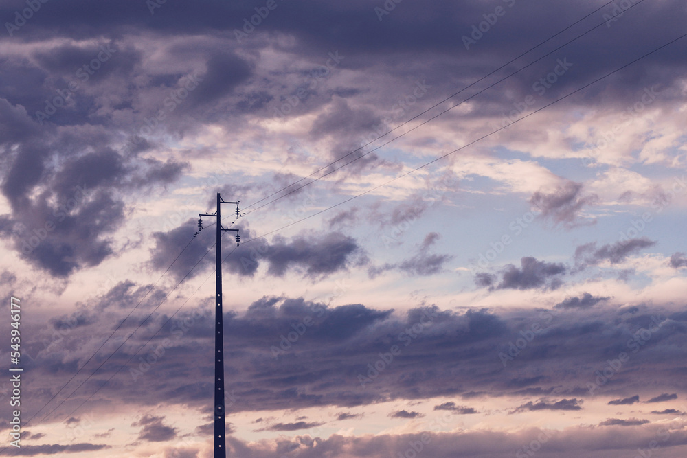 power pole at sunset with blue and purple colored sky