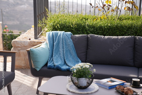 Canvas Print Knitted Throw, black sofa in the courtyard of the home garden