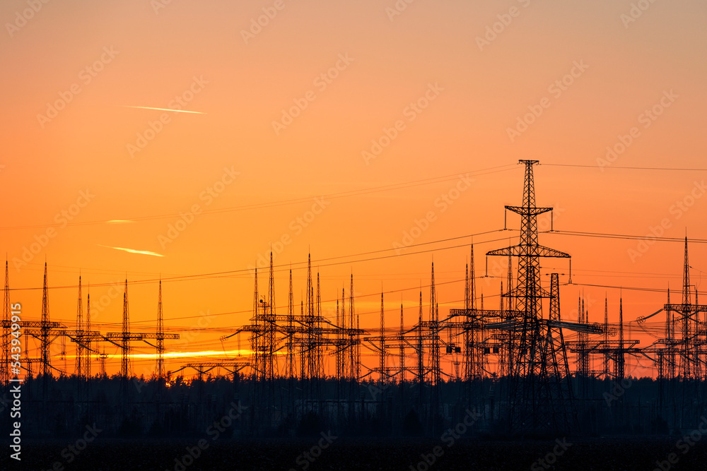 Power lines silhouettes at sunset