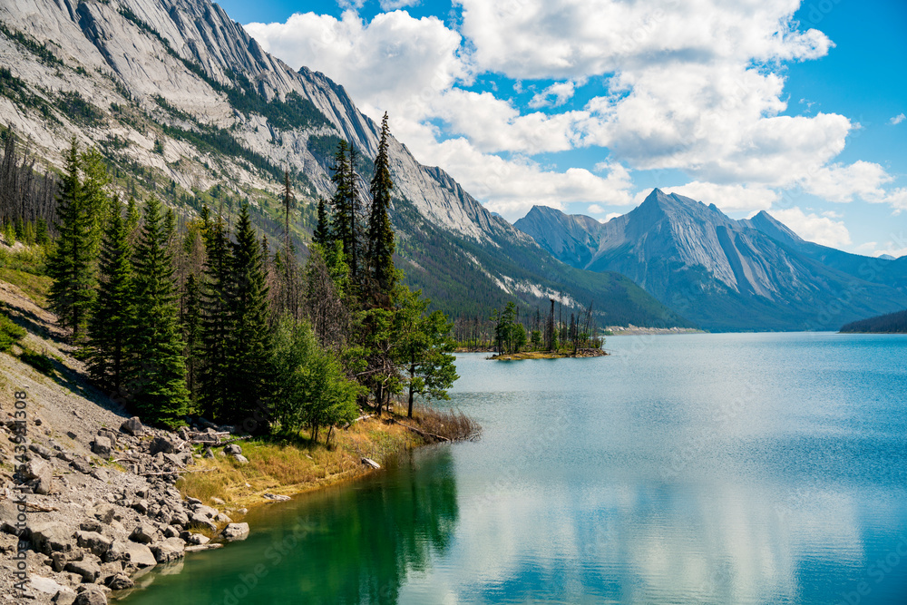 Medicine Lake in Jasper National Park, Alberta, Canada. Beautiful and serene landscape in a sunny summer day.
