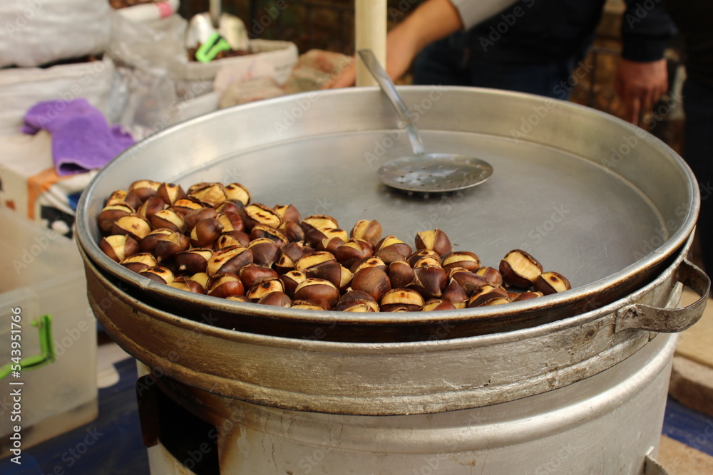 Fresh roasted chestnut on a roasting stall