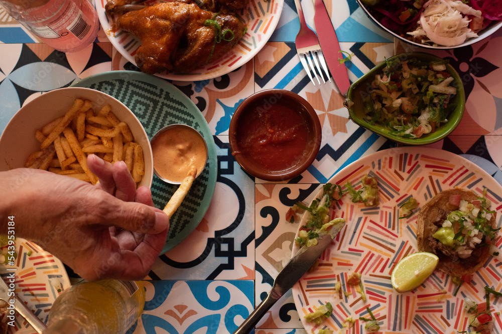 people eating authentic Mexican food at a party Stock Photo | Adobe Stock
