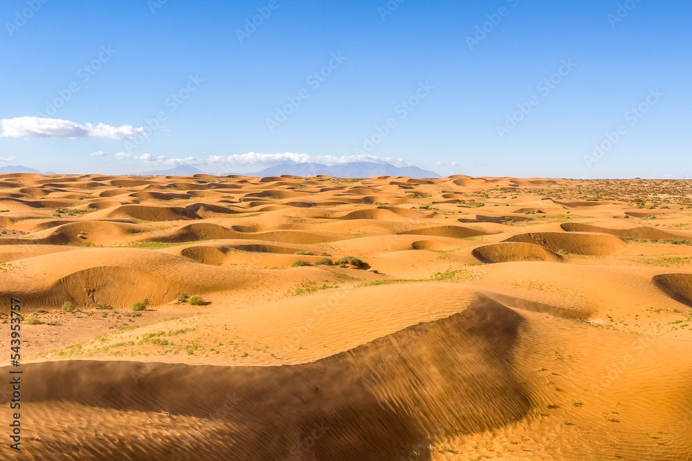 Sand dunes in Utah desert in a windy day