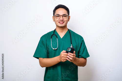 Asian male nurse or doctor hold smartphone, check messages from patient, use mobile app for medical workers easy comfort usage of modern tech concept