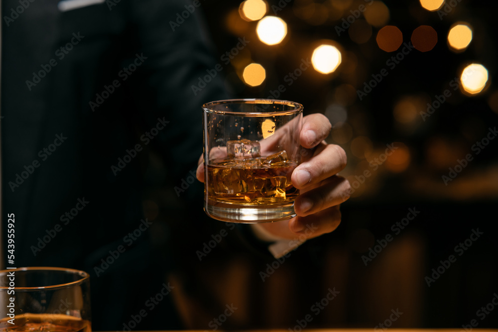 Barman pouring whiskey whiskey glass beautiful night