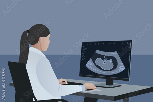 A female doctor looks at the result of an ultrasound scan. Medical diagnosis of a child in the womb, pregnancy and health, the procedure for examining the embryo, placenta, umbilical cord