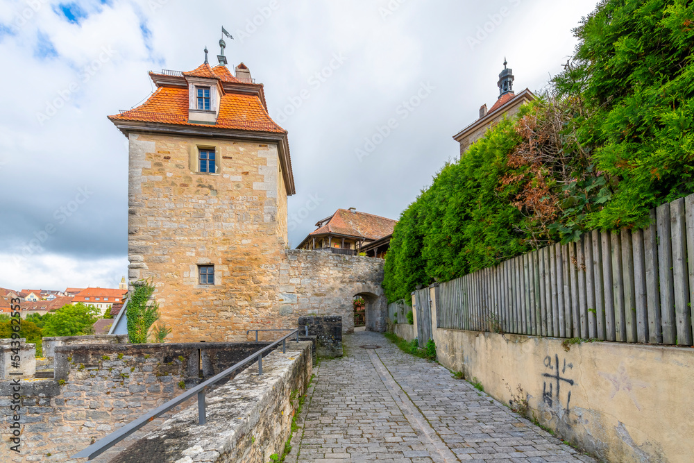 A cobblestone walkway and tower along the outer medieval walls of the Bavarian city of Rothenburg ob der Tauber, on Germany's Romantic Road.