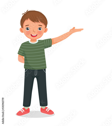 cute little boy showing presenting with hand making welcome gesture