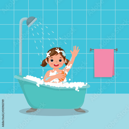 Cute little girl taking a bath in the bathtub