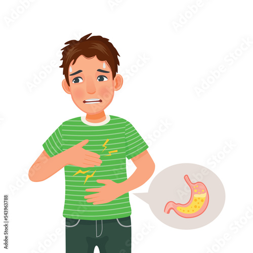 Young man suffering from acid reflux holding his chest feeling heartburn sensation