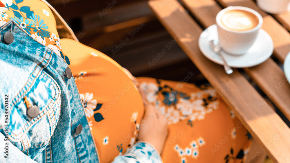 Pregnant coffee drink woman. Happy pregnancy girl drink hot coffee in restaurant. Represent breakfast for energy and freshness concept.