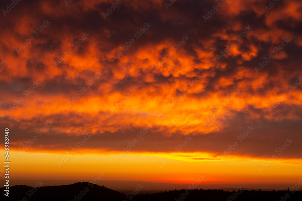 stunning clouds illuminated by the sunset