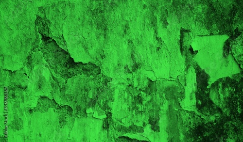 background concept using green cracked old wall material, chipped wall surface forming abstract art, old green themed wall background