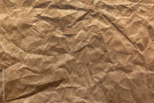 The texture of crumpled brown wrapping paper. Abstract paper background and pattern