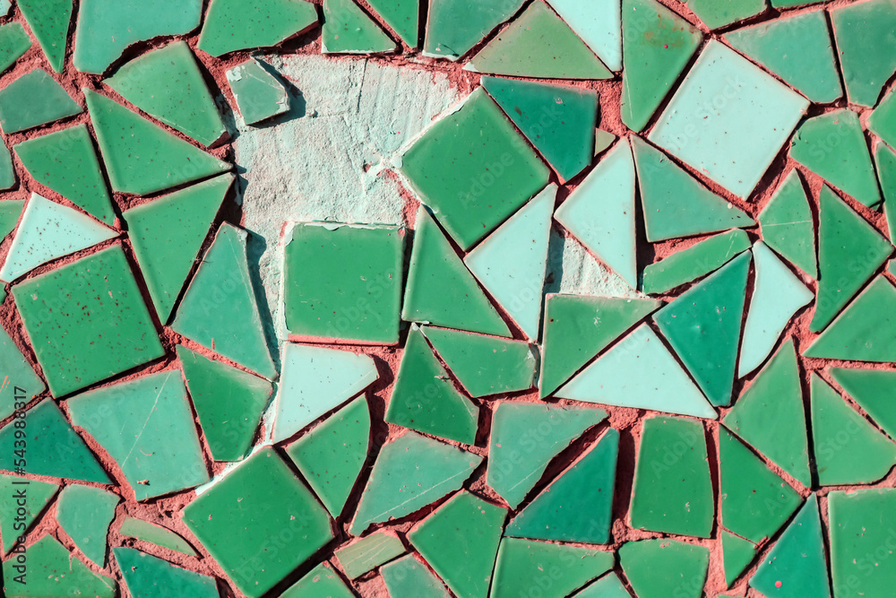 Old mosaic from old broken ceramic tiles as a background. Breccia ...