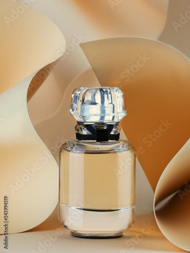 glass perfume bottle on beige background