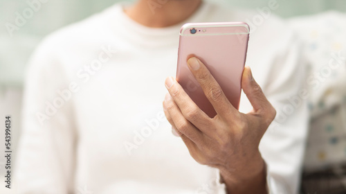hand of person holding smartphone and looking application ond smartphone, Application web design concept