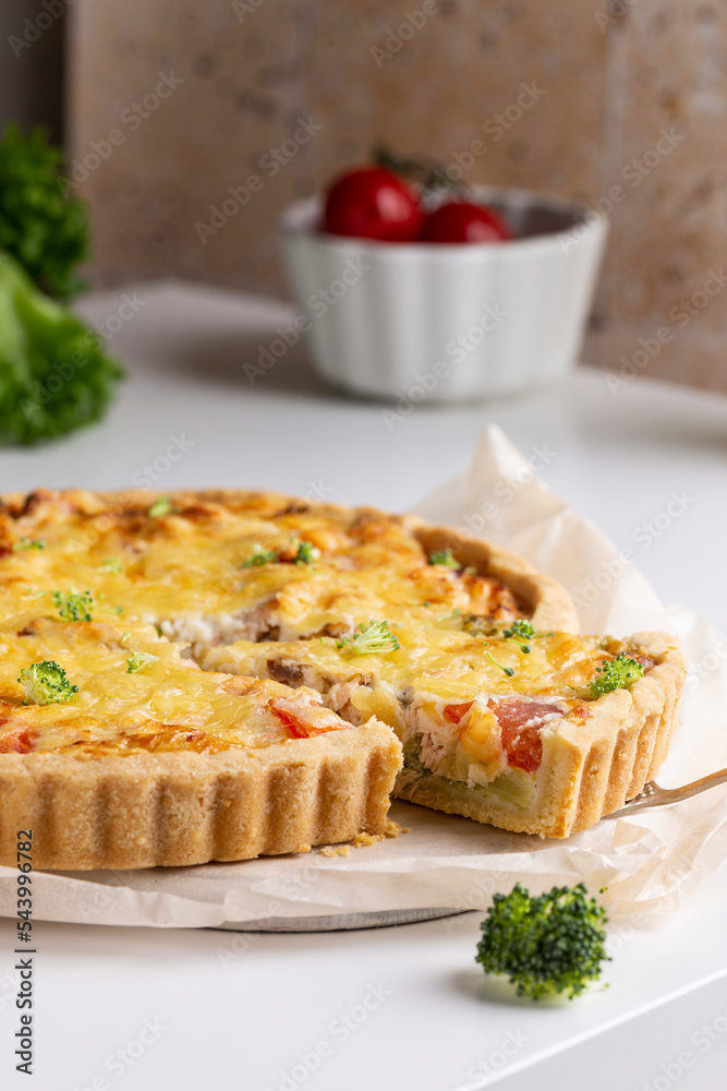 Freshly baked quiche with salmon and broccoli Freshly baked quiche with salmon and broccoli