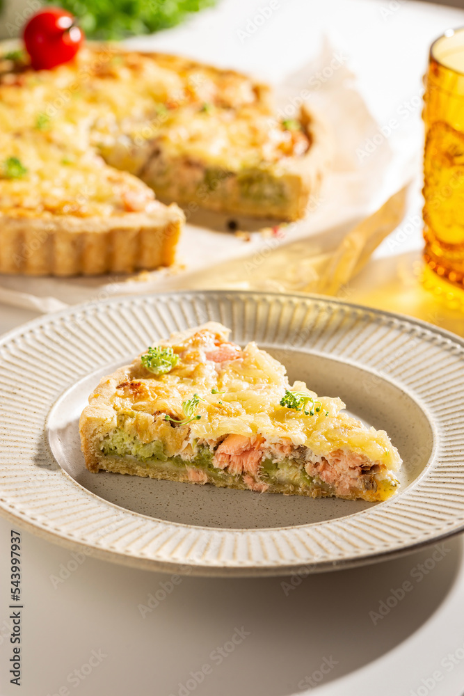 Dinner with fresh homemade pie with salmon fish and broccoli, quiche Dinner with fresh homemade pie with salmon fish and broccoli, quiche