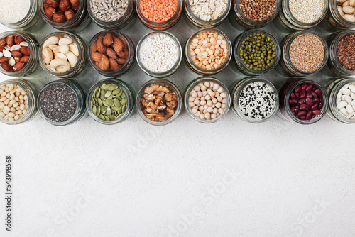 Vegan protein source. healthy vegetarian food. top view of seeds, nuts, peas, beans, rice, spelt, oatmeal on white background copy space
