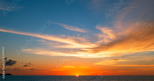 Sunset or sunrise sky clouds over sea,Beautiful sunlight in the ocean,Amazing nature landscape seascape Colorful sky clouds background
