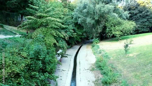 Aerial view of small canal water at Petrusse Valley nature with athlete runner photo