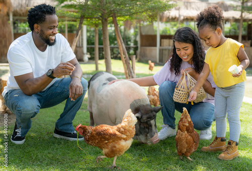 фотографія African american family go to travel in animal farm in Thailand