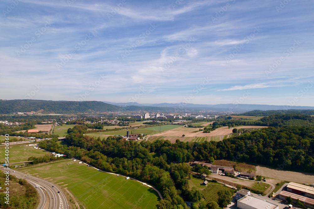 Aerial view of City of Pratteln, Canton Basel-Landschaft, on a sunny summer day. Photo taken August 24th, 2022, Pratteln, Switzerland.