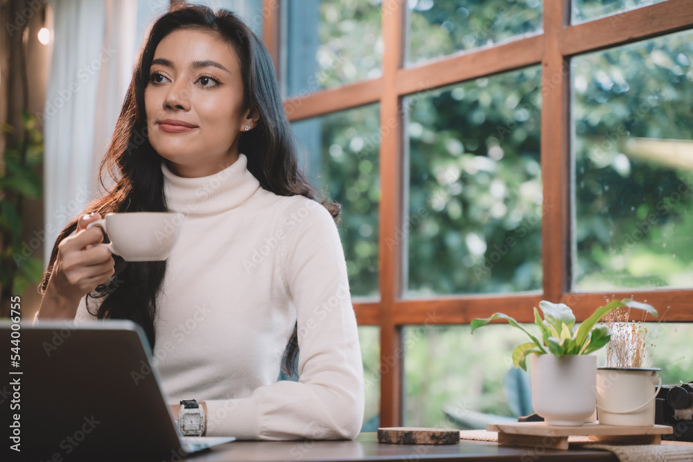 Businesswoman are happy, smile and using technology about laptop for work and job in your lifestyle at cafe. She are success person in your life. Businesswoman are happy, smile and using technology about laptop for work and job in your lifestyle at cafe. She are success person in your life.
