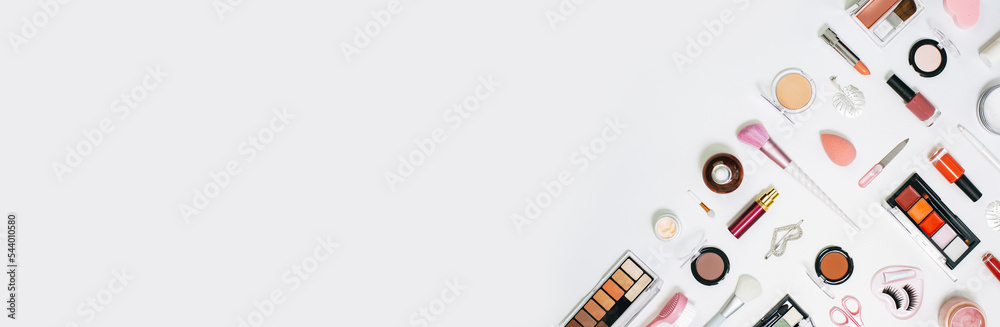 Feminine makeup pink red orange palette accessories with nail polish manicure tools on white background. Flat lay pattern with copy space, beauty and cosmetics blogger concept banner Feminine makeup pink red orange palette accessories with nail polish manicure tools on white background. Flat lay pattern with copy space, beauty and cosmetics blogger concept banner