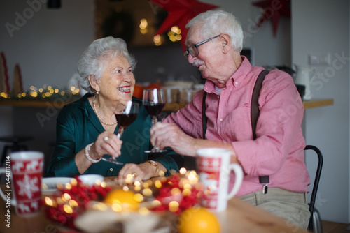 Canvas Print Happy senior couple celebrating Christmas Eve together.