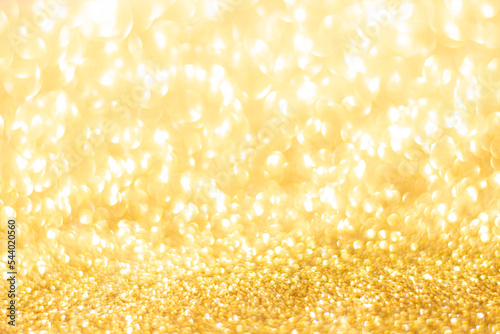 Gold glitter defocused texture background. gold christmas abstract background.