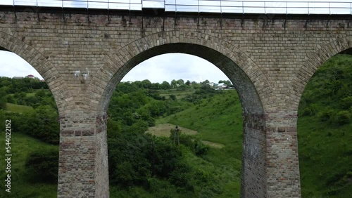 Aerial view of an old railway viaduct, Austro-Hungarian railway bridge in the village of Plebanivka in the Ternopil region of Ukraine, Travel sight points in Ukraine photo