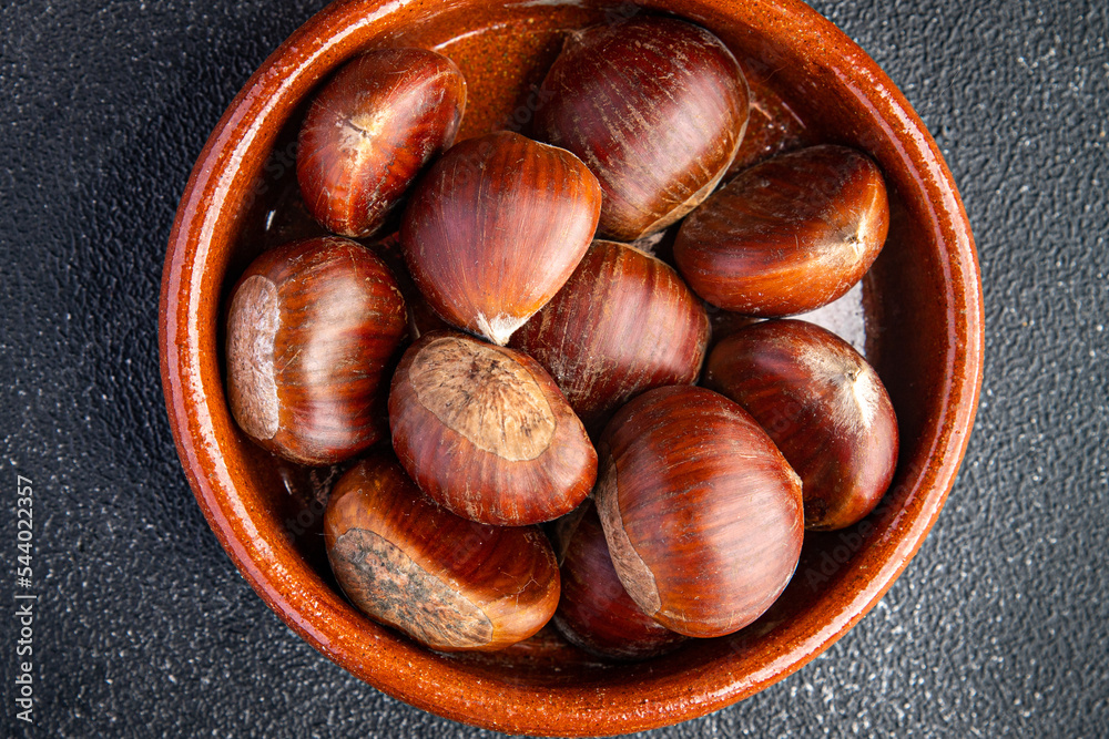 Fototapeta premium chestnuts edible snack meal food on the table copy space food background rustic top view